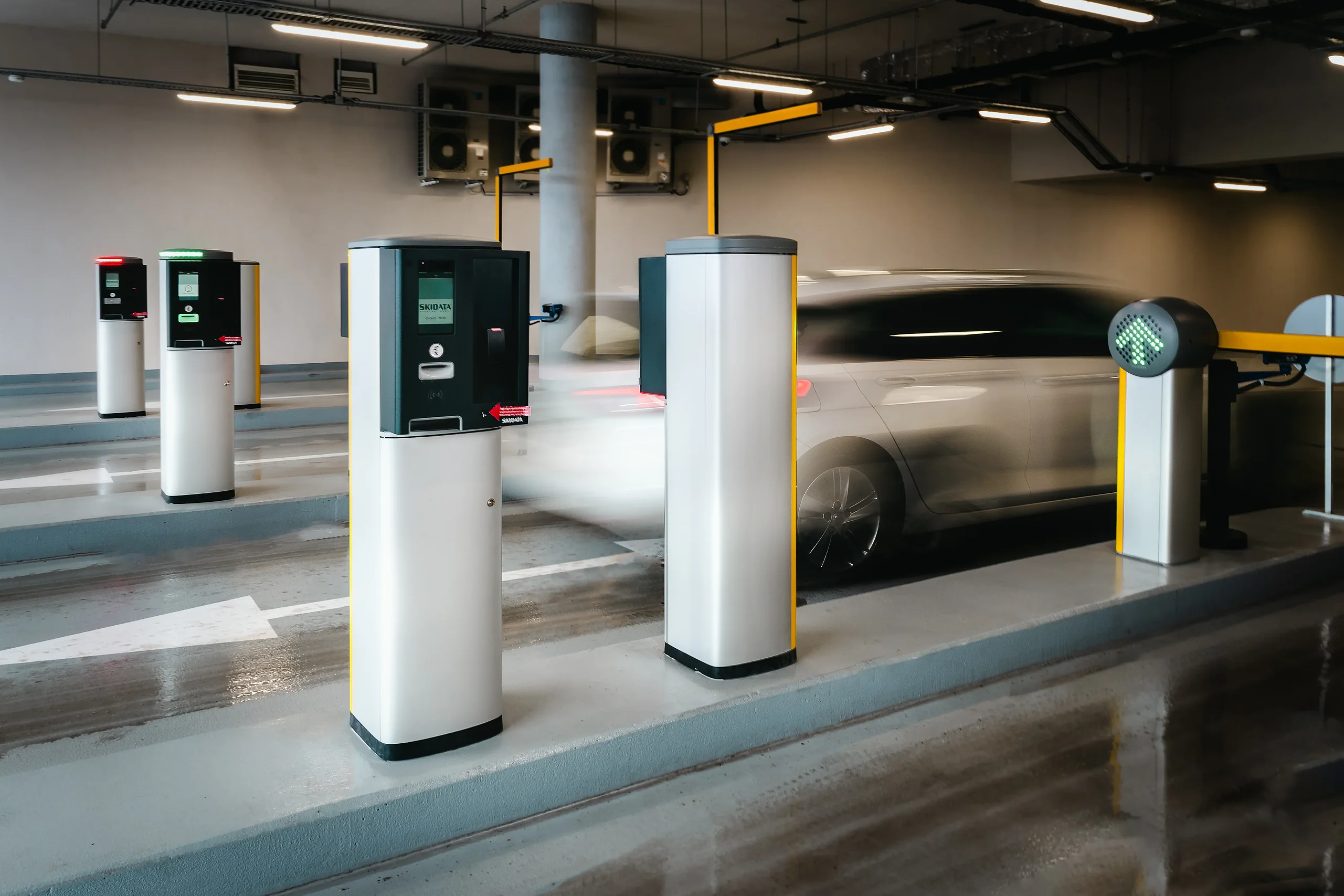 Car passing through an automated vehicle access control system in the MOL Campus car park