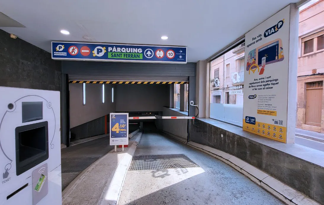 Parking entrance with barrier and ticketing system