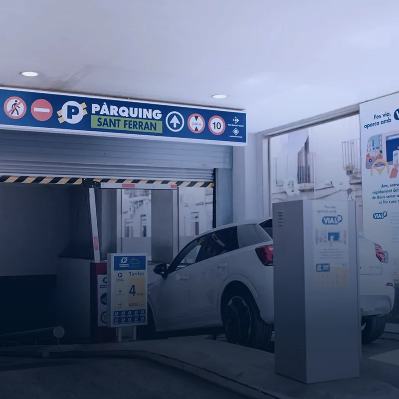 Car at Sant Ferran parking entrance beside ticket machine