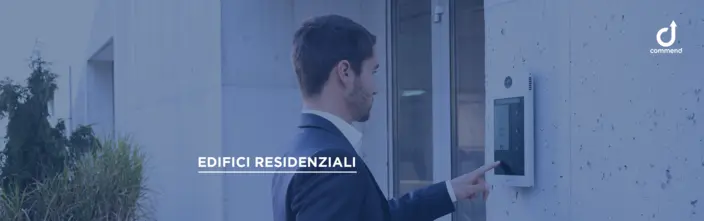 Modern Residential Intercom System Man uses modern digital intercom system outside residential building for secure entry.