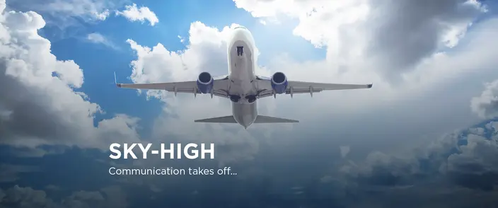 Sky-High Communication Takes Off White airplane ascending into a bright blue and cloudy sky with "SKY-HIGH Communication takes off..." text.